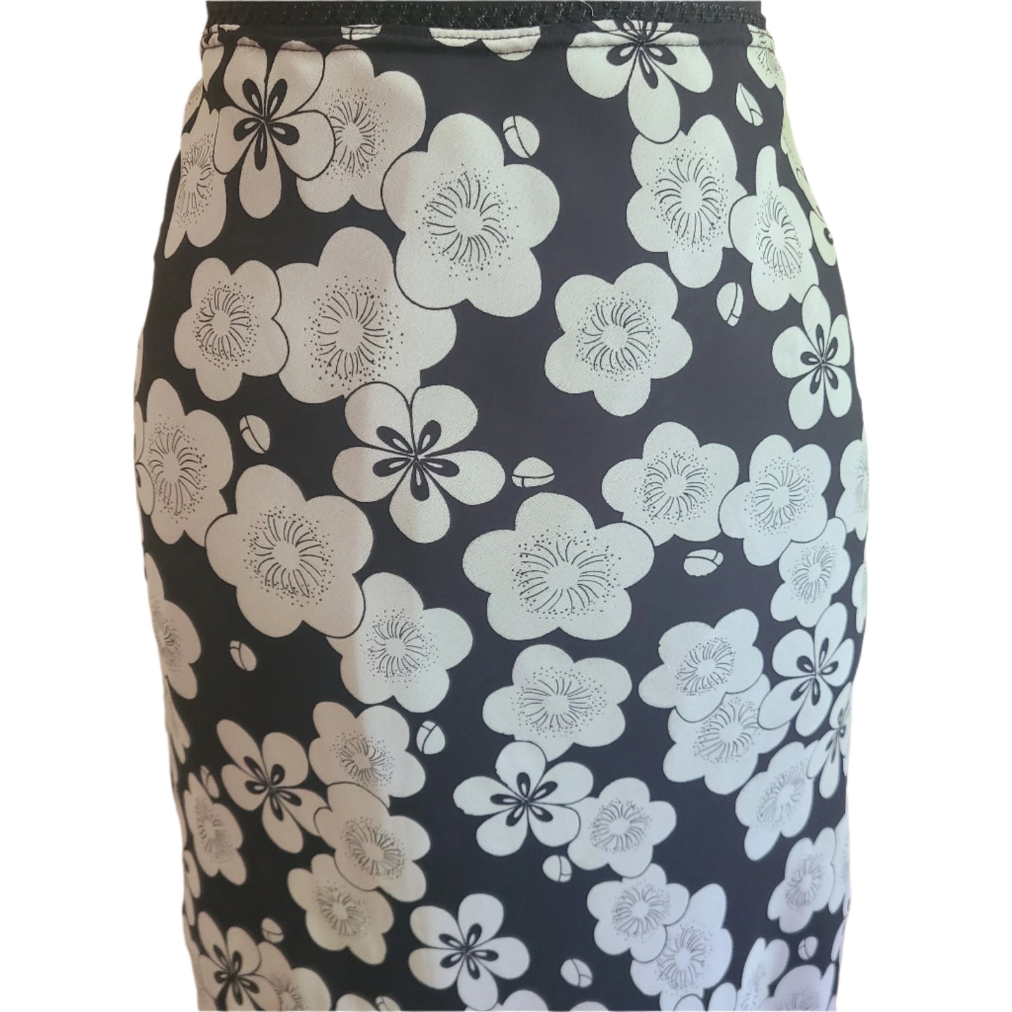 Retro white floral patterned skirt on a black background