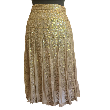 Gold sequin designer skirt on a sheer fabric