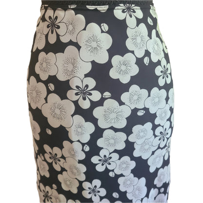 Retro white floral patterned skirt on a black background