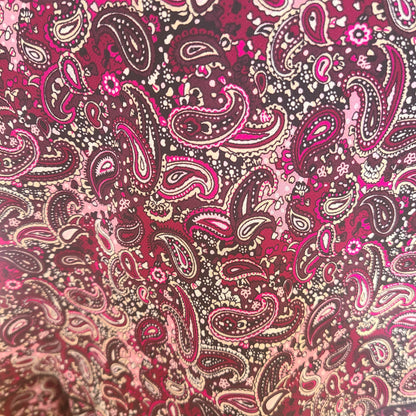 Patterned fabric with purple, pink and brown paisley design